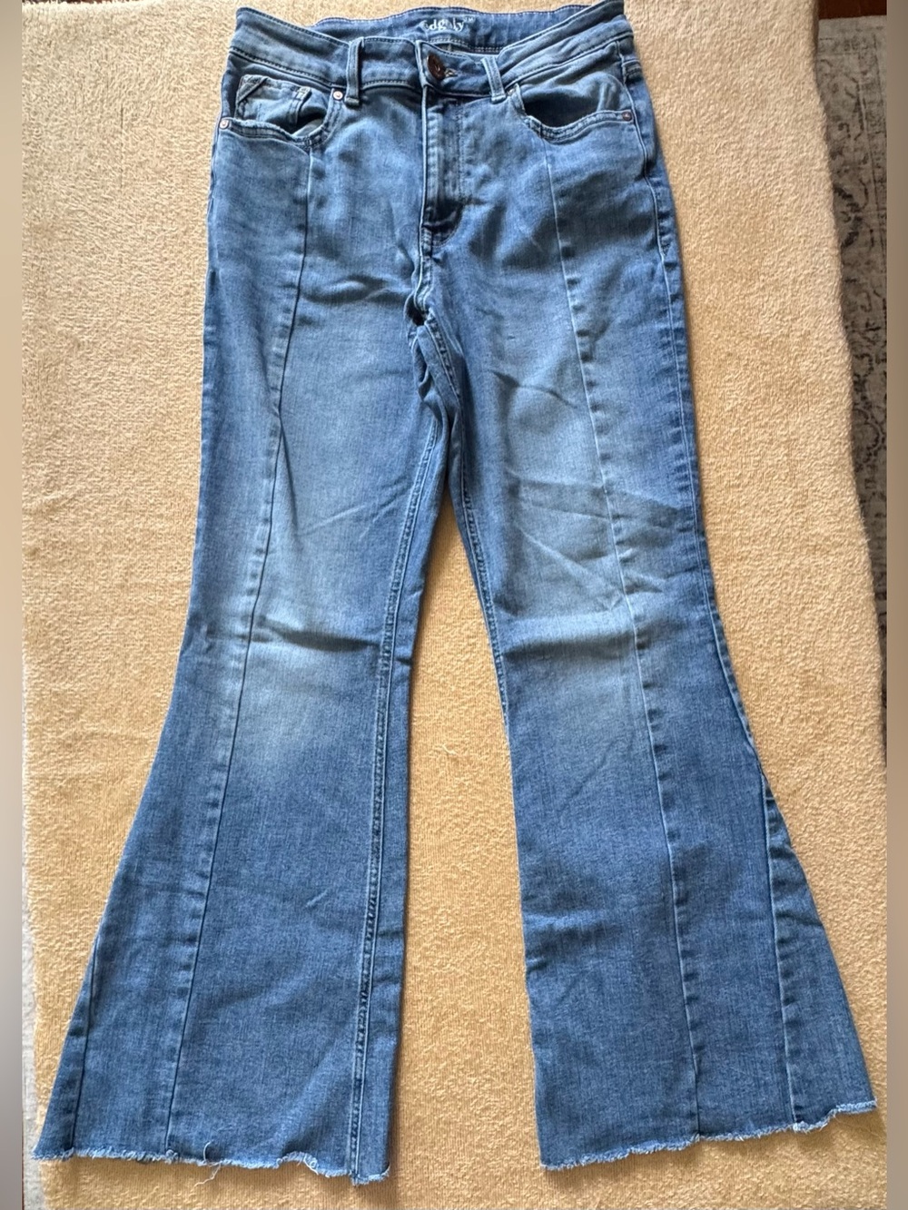 Classic Mid-Rise Blue Flare Jeans with Subtle Raw Hem